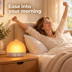 Woman stretching awake in bed next to the Soft Rise clock at 6:40 AM, text: Ease into your morning