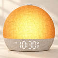 Soft Rise Sunrise Alarm Clock, linen shade lit in sunrise mode