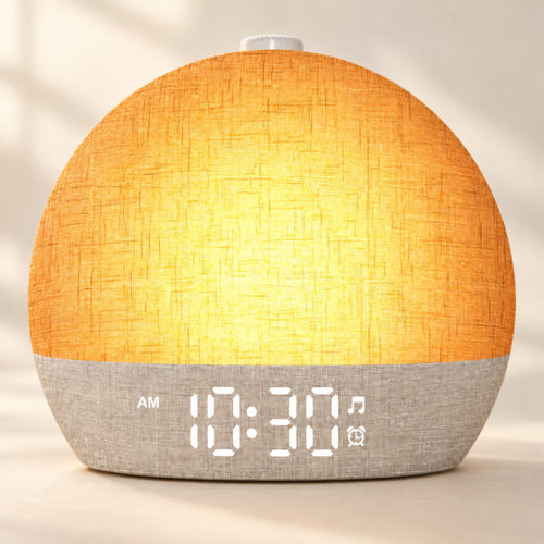 Soft Rise Sunrise Alarm Clock, linen shade lit in sunrise mode